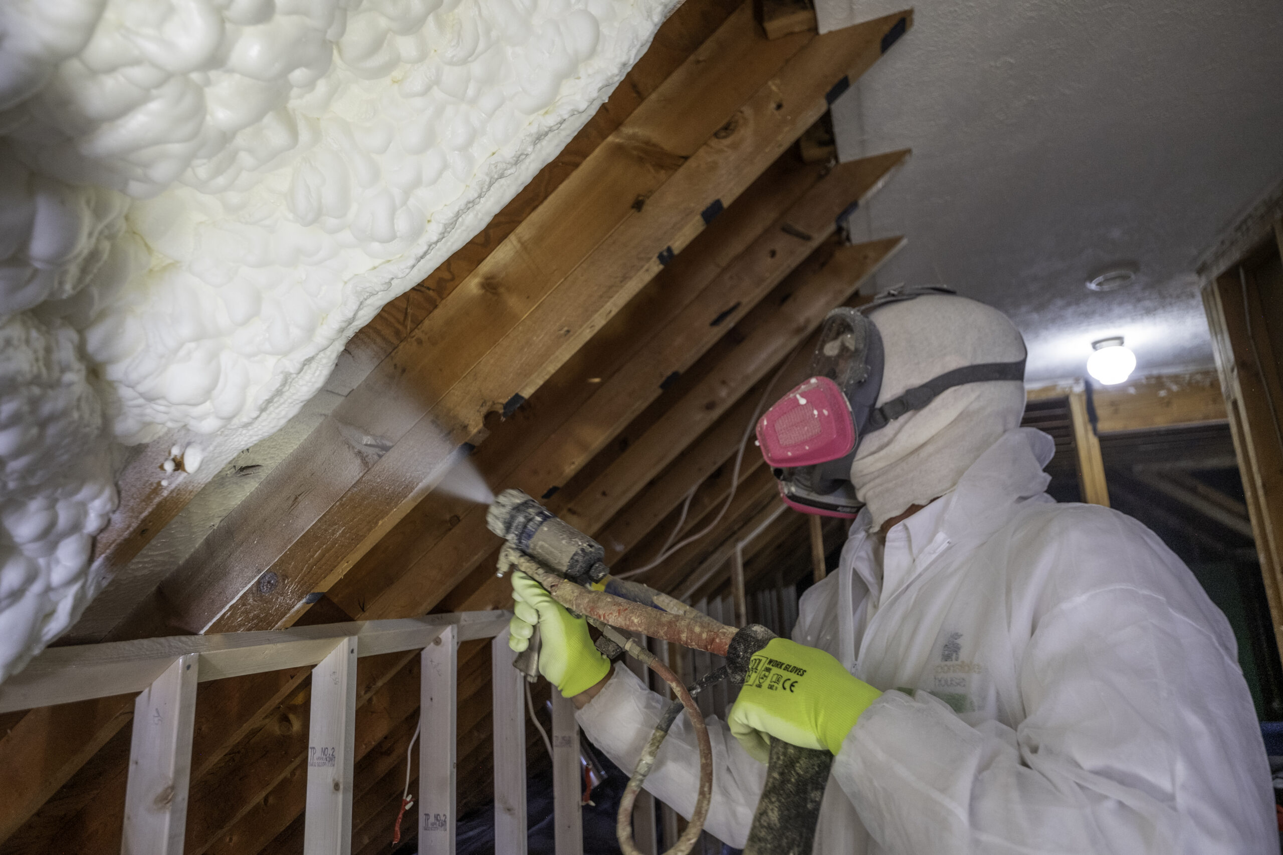 spray foam insulation being put in