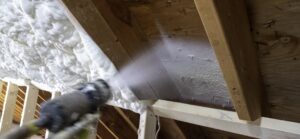 Spraying sprayfoam insulation onto wall. Service Page Header image